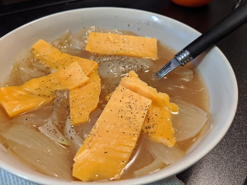 onion soup topped with pepper